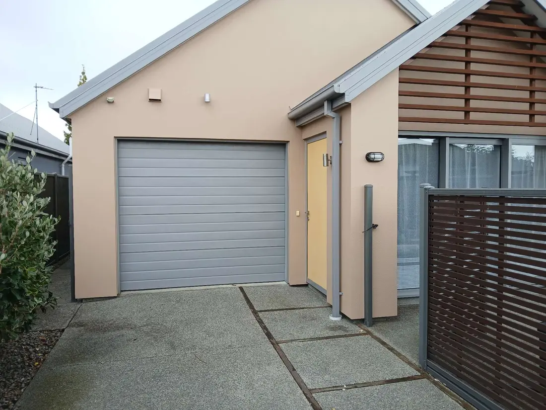 Plastered home exterior after maintenance and repair — fresh, restored finish