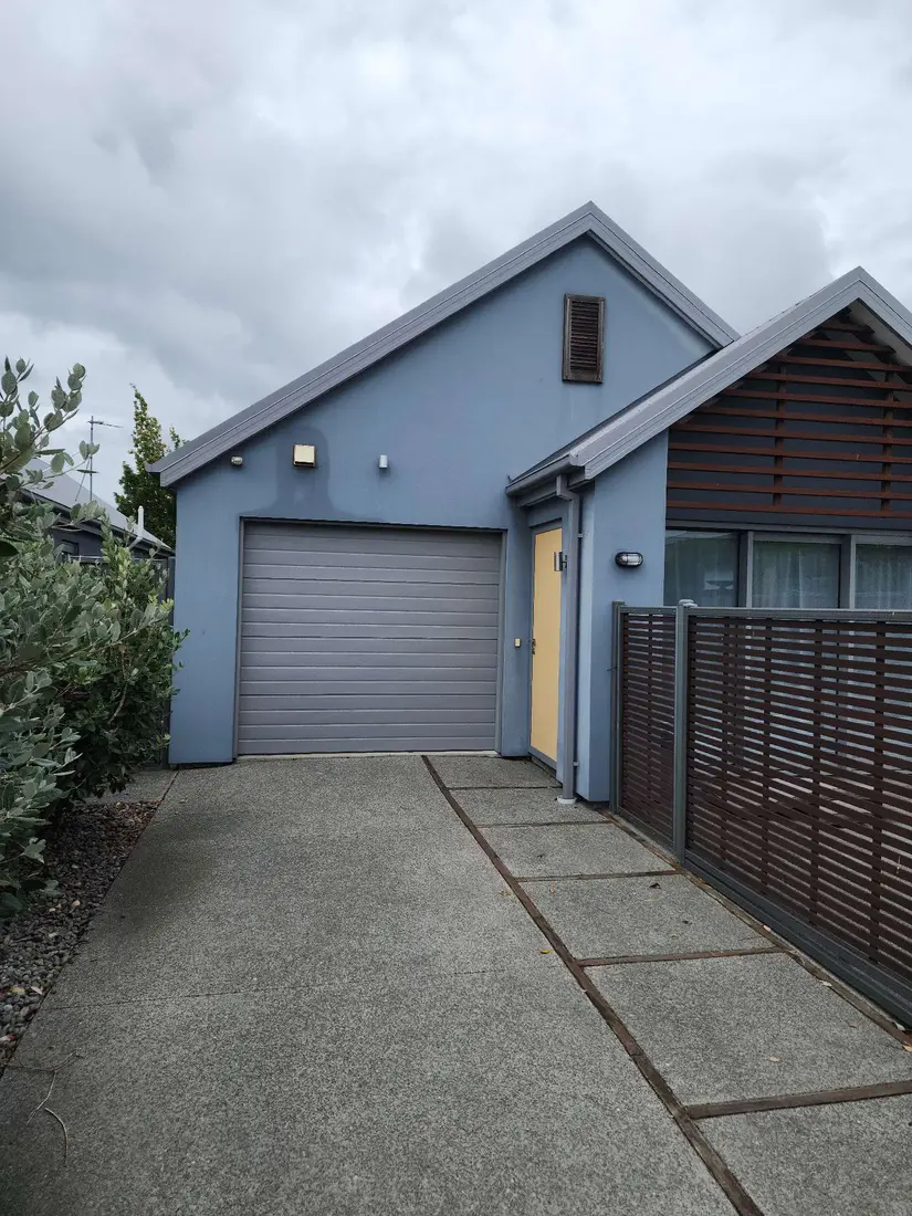 House exterior before plastering — faded blue render